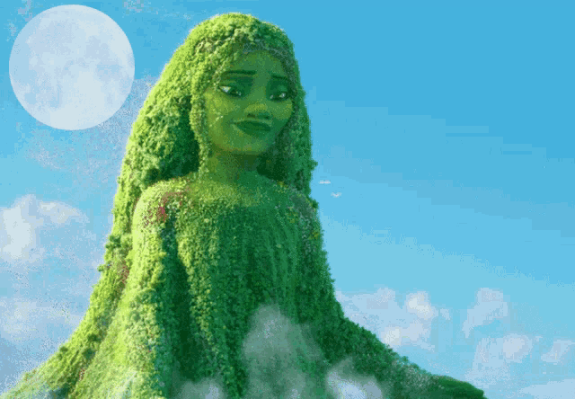 a statue of a woman made of green plants
