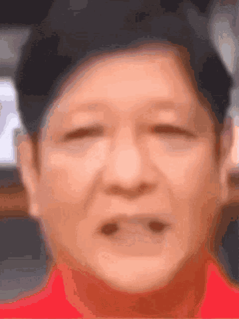 a close up of a man 's face with his mouth open