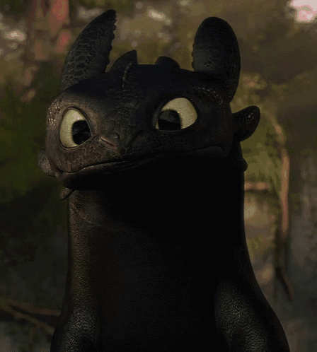 toothless from how to train your dragon looks at the camera with his tongue out