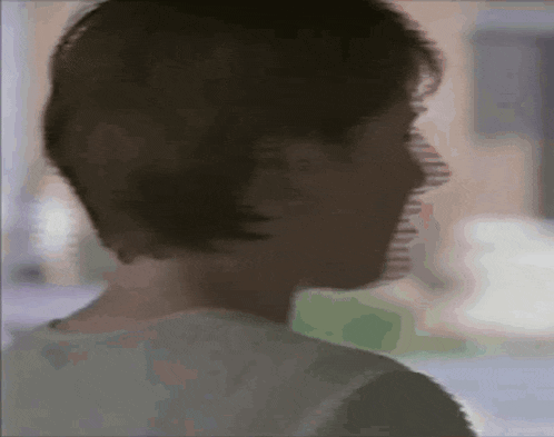 a blurred image of a person 's face with a shadow on it