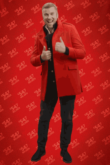a man in a red coat is giving a thumbs up in front of a red background with the number 547 on it