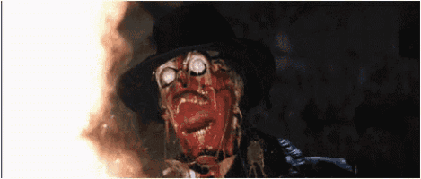 a scarecrow with blood coming out of his eyes and a hat