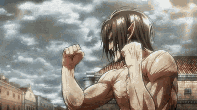 a man is flexing his muscles in front of a building in a city .