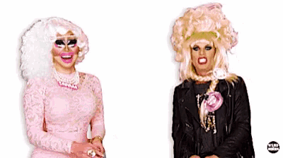 two drag queens standing next to each other with the word doctor behind them