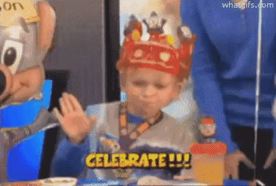 a child is wearing a crown and says celebrate