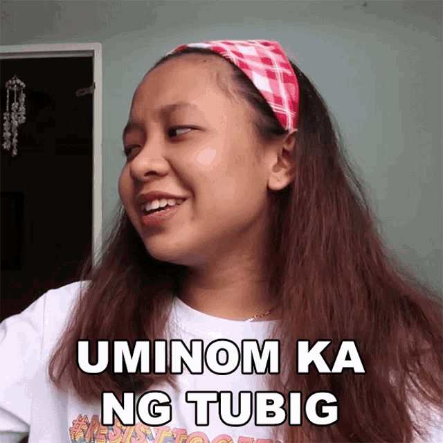 a girl wearing a headband and a white shirt says uminom ka ng tubig