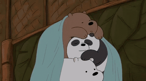 three bears are laying on top of each other under a blue blanket