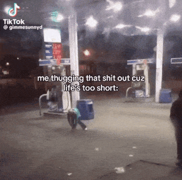 a tiktok video of a person throwing a trash can at a gas station