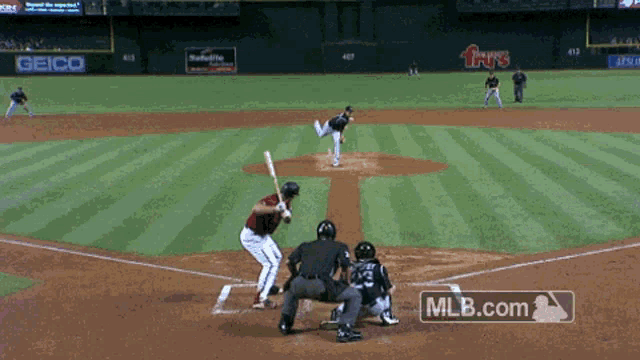 a baseball game is being played and mlb.com is displayed in the corner