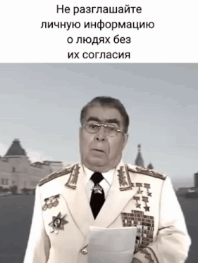 a man in a military uniform holds a piece of paper in front of a foreign language caption