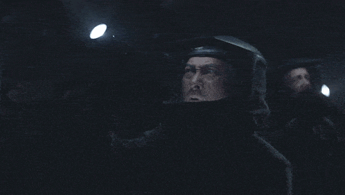 a man wearing a helmet with a light on his face