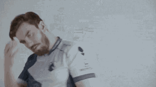 a man with a beard is wearing a blue and white shirt that says hon on the sleeves