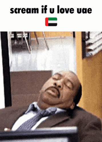 a man in a suit and tie is laying down with the words scream if u love uae on the bottom