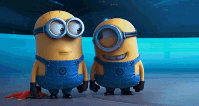 two minions are standing next to each other with one wearing overalls