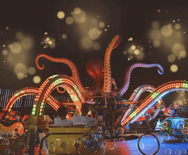 an octopus ride at an amusement park with bubbles coming out of it