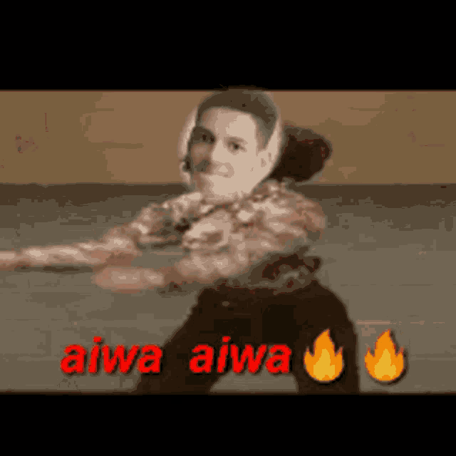 a video of a man dancing with the words aiwa aiwa in red