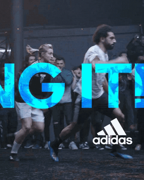 an ad for adidas shows two soccer players in a crowd