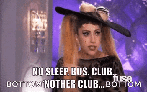 lady gaga is wearing a black hat and saying no sleep , bus , club , bottom neither club , bottom .
