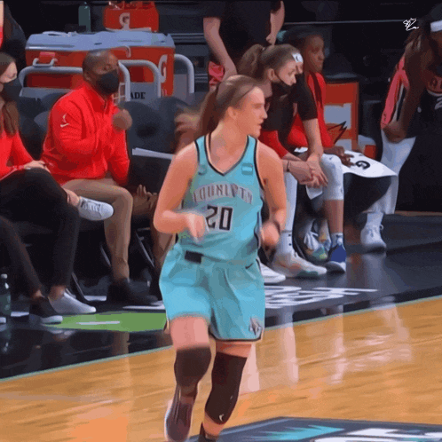 a female basketball player wearing a jersey that says charlotte 20