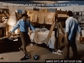 two men are standing in a room with a bunk bed .