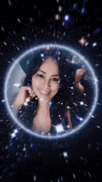 a woman 's face is surrounded by a glowing circle of stars