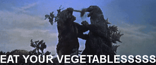 two monsters fighting with the words eat your vegetablesss