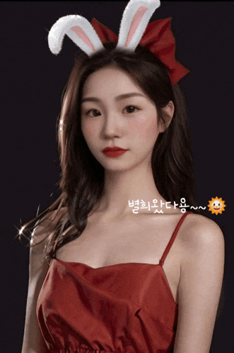 a woman wearing bunny ears and a red bow on her head