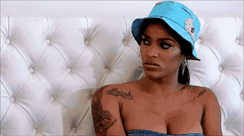 a woman with a tattoo on her shoulder that says miracles