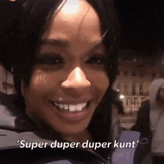 a woman is smiling with the words `` super duper duper kunt '' written on her face .