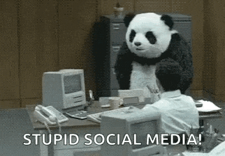 a panda bear is standing next to a man at a desk in an office .