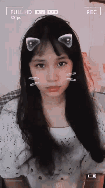 a girl with cat ears on her face is being recorded in full hd