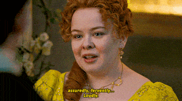 a woman in a yellow dress is saying assuredly fervently ... loudly