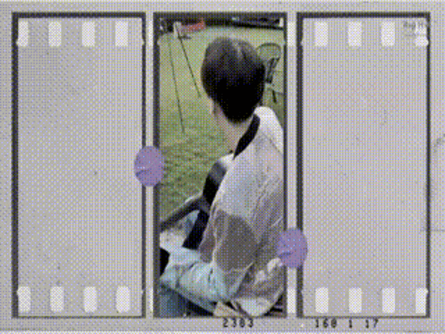 a man is sitting on a bench playing a guitar in a film strip .