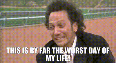 a man in a suit and tie is smiling with the words `` this is by far the worst day of my life '' .