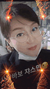 a woman wearing glasses and a mask with chinese writing on the bottom