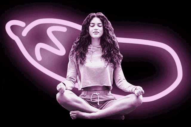 a woman sits in a lotus position with her eyes closed in front of a neon sign that says s