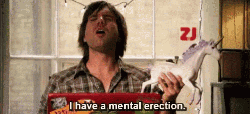 a man in a plaid shirt is holding a toy unicorn and saying i have a mental erection