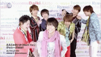 a group of young men are posing for a picture and one of them is smiling