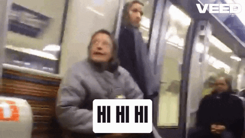 a woman sitting on a bench on a subway train with a sign that says hi hi hi