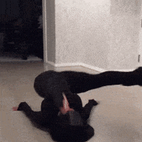 a woman is laying on the floor with her legs crossed .