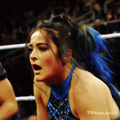a woman with blue hair is in a boxing ring with tiffanyluv24 written on the bottom right