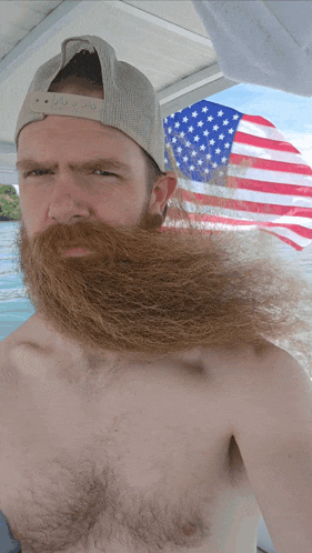a shirtless man with a long beard wearing a hat that says ' abercrombie & fitch ' on it