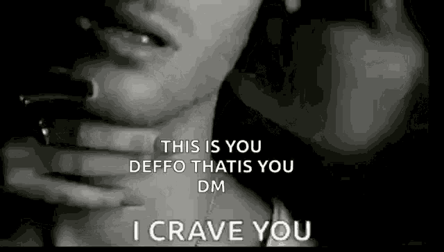 a black and white photo of a woman licking a man 's neck with the words `` i crave you '' .