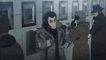 a man is talking on a phone with a sign on the wall that says ' telephone ' on it