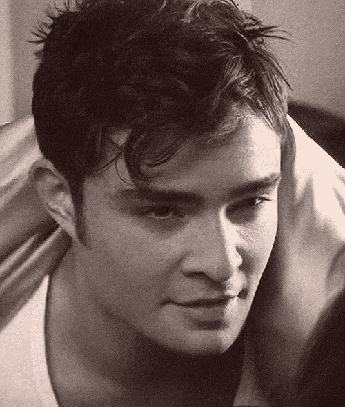 a close up of a man 's face in a black and white photo