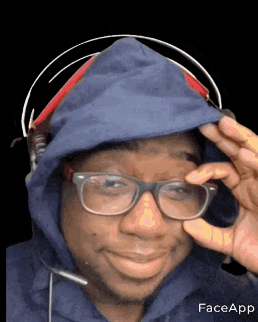 a man wearing glasses and a hoodie has faceapp written on the bottom right