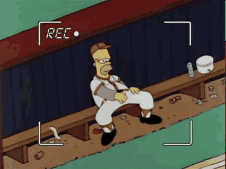 a cartoon of homer simpson sitting on a bench with the word rec on the screen