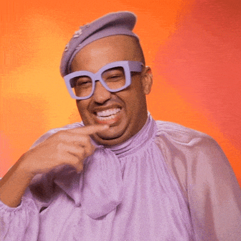 a man in a clown costume says i 'm a clown while pointing