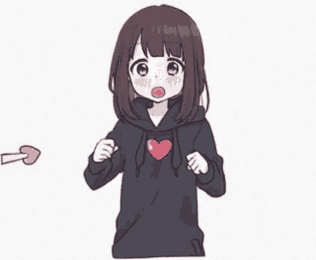 a girl in a black hoodie is holding an arrow in her hand .