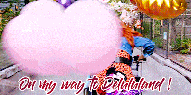 a woman is riding a bike with balloons and cotton candy behind her and the words on my way to delilululand
